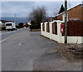 Queen Elizabeth II postbox on a wooden pole, Woodland Road, Croesyceiliog, Cwmbran