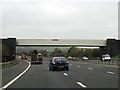 The M65 runs under a railway bridge