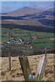 SH8727 : Stile with grid reference and view by Andrew Hill