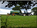 Muck-spreading in a field near Lyneal Wharf