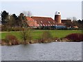 Looking across Caldecotte Lake to the Premier Inn