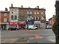 SJ8493 : Shops on Wilmslow Road by Gerald England