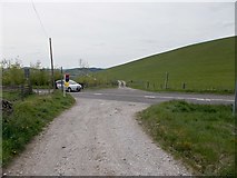 SJ9778 : Farm track crossing the B5470 Macclesfield Road by Antony Dixon