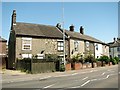 Terraced cottages in Carrow Road (A1242)