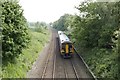SK4939 : Leeds train approaching a foot bridge near Stapleford Hill by Mark Anderson