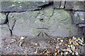 Benchmark on base stone in wall of Burnley Road