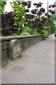 Defaced boundary stone beside Burnley Road