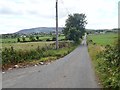 View West along Carn Road as it approaches the  cross roads with Ballymacdermot Road