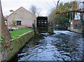 A weir on the River Wandle by Merton Abbey Mills