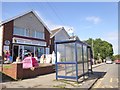 Bus shelter outside a surf shop, Kittle