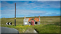 NB5362 : Abandoned building and phone box by Peter Moore