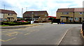 Bus stop and houses at a bend in Lasgarn View, Varteg