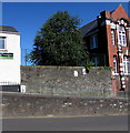 In Our Footsteps ceramic shoes plaques on a Stow Hill wall, Newport