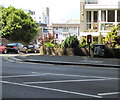 Queen Elizabeth II postbox and a graffiti-daubed telecoms cabinet near a Plymouth corner