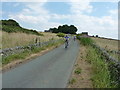 Cyclists approaching Flat Head cottage