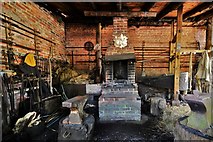 TL8647 : Long Melford, Kentwell Hall: The forge by Michael Garlick