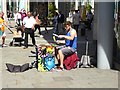 SJ8398 : Street musician in St Mary's Gate by Oliver Dixon
