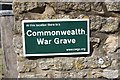 TF0436 : The Church of St Botolph: Commonwealth War Grave sign by Bob Harvey