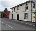 Yellow defibrillator box on a Tynewydd Row wall, Ogmore Vale