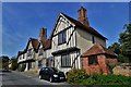 Stoke by Nayland: A terrace of half timbered dwellings next to the church