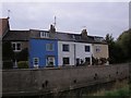 Brightly coloured houses facing the River Brit, Bridport