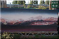 View of a canvas painting in the Nomadic Community Gardens next to the London Overground line