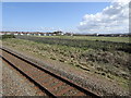 View from a Chester-Holyhead train - Empty field between caravan parks, Belgrano