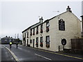 Cycling past the Golden Lion...