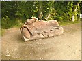 Carved bench in public park at Evanton