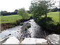 The Creggan River emerging from beneath the  Liscalgot Road bridge