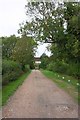 View along track under bridge of dismantled railway