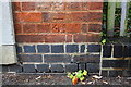 Benchmark on old electricity substation beside lane off Raymond Road