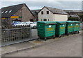 Four green wheelie bins near Lion Street, Abergavenny