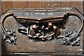 Ripon Cathedral, c15th Misericords 21: A man pushing a woman in a three wheeled barrow