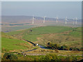 Glimpse of the A671 near Long Shay