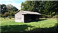 Farm shed in field