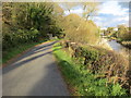 SD3576 : Minor road beside the River Eea links Crook Wheel to Cark by Peter Wood