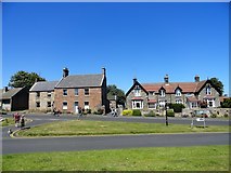 NU1834 : Road junction in the middle of Bamburgh village by Robert Graham