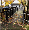 West across a river footbridge towards Water Street, Ogmore Vale