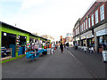 Alongside Bolton market hall