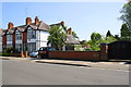 Bridge over stream and houses of Holmfield Road