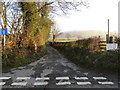 Hedge and tree-lined minor road to nowhere - other than the places listed on the notice