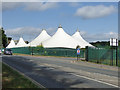 Tent-like structures alongside Par Moor Road