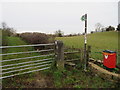 Public footpath, stile, gatepost and a bench mark at Bwlch y Ddeufryn, Gwernaffield