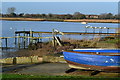 Blue boat and jetties on Stanpit shore