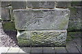 Benchmark on buttress of Friary United Reformed Church