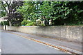 Wall on north side of High Street approaching Manley Street junction