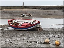 TF8444 : Boats on the mud at Burnham Overy Staithe in Norfolk by Richard Humphrey