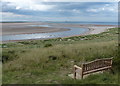 NU1635 : Seat overlooking Budle Water and Budle Bay by Mat Fascione