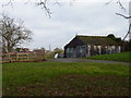 Old garages on Copyholt Lane with Stoke Court in the distance